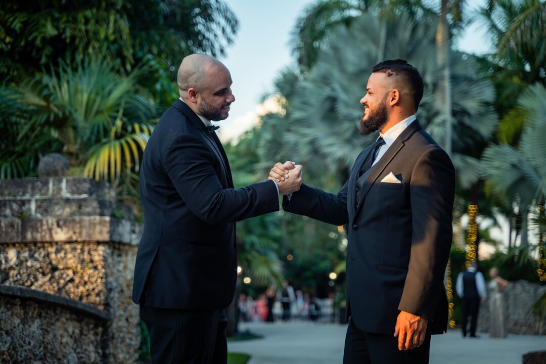 men shaking hands in suit